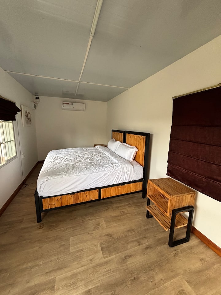 Cabin bedroom with a king bed and air conditioning